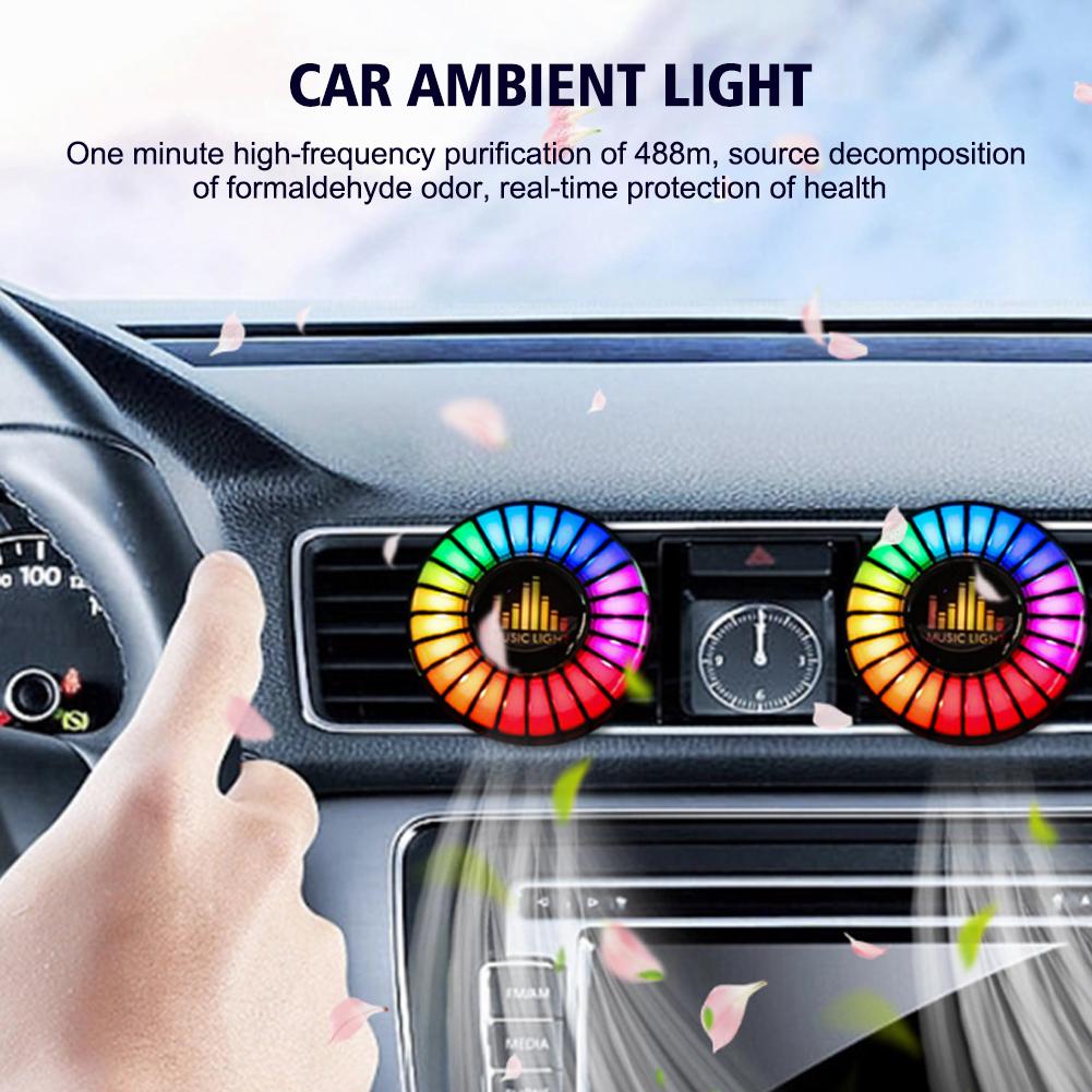Car ambient light air freshener helping freshen the cabin while adding a glowing RGB accent on the dashboard vents.