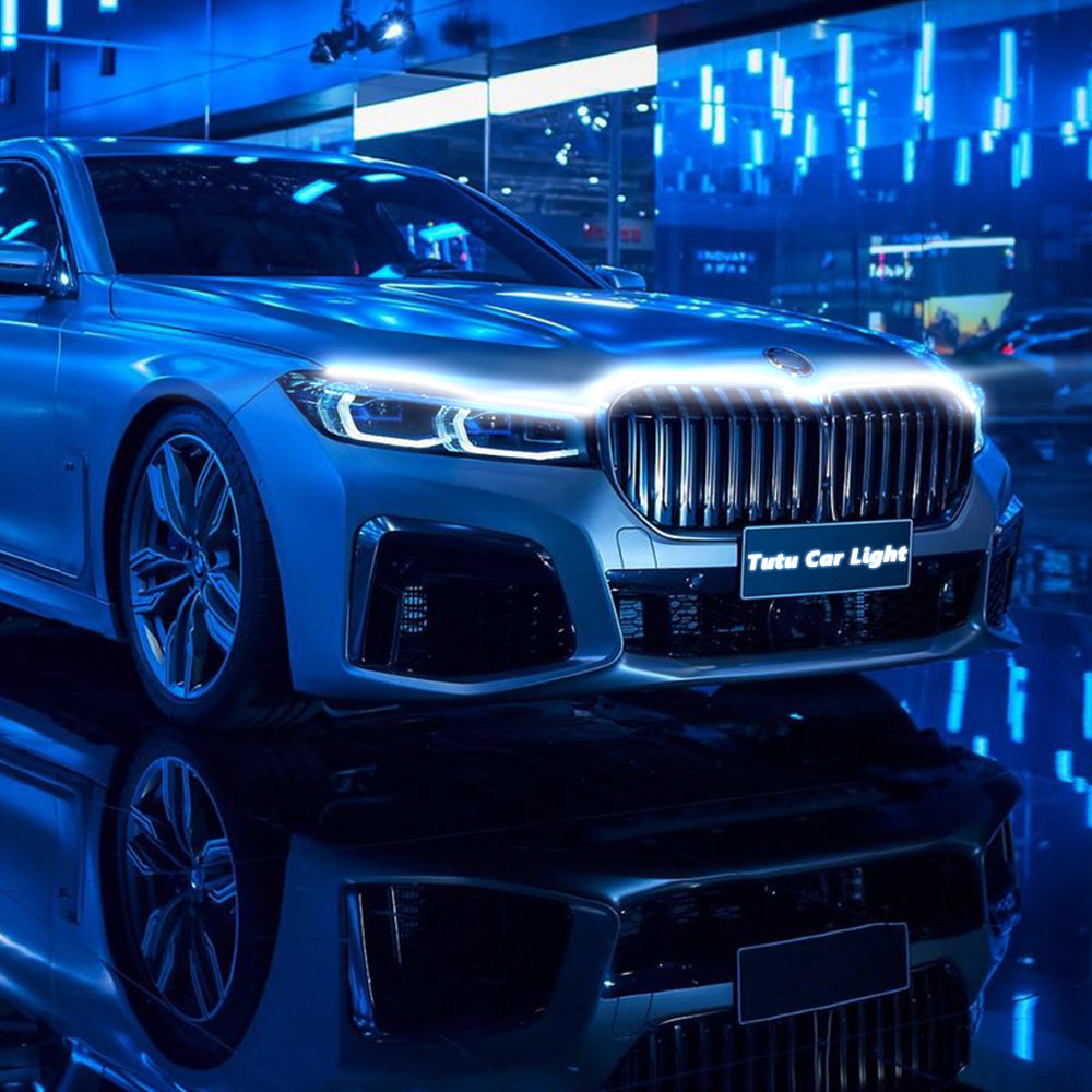 Dynamic scan hood LED light strip glowing across a car front end for decorative exterior styling.