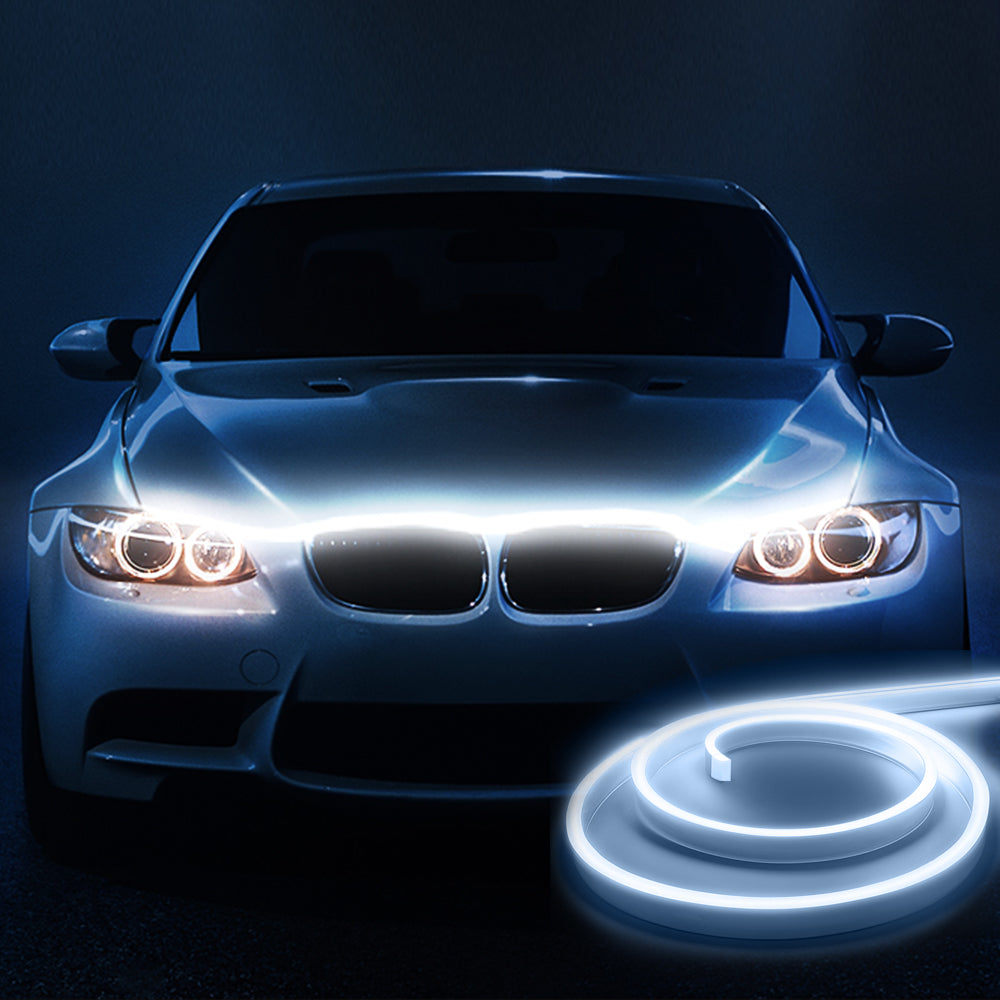 Dynamic scan hood light strip installed across the front of a car with a clean white startup glow.