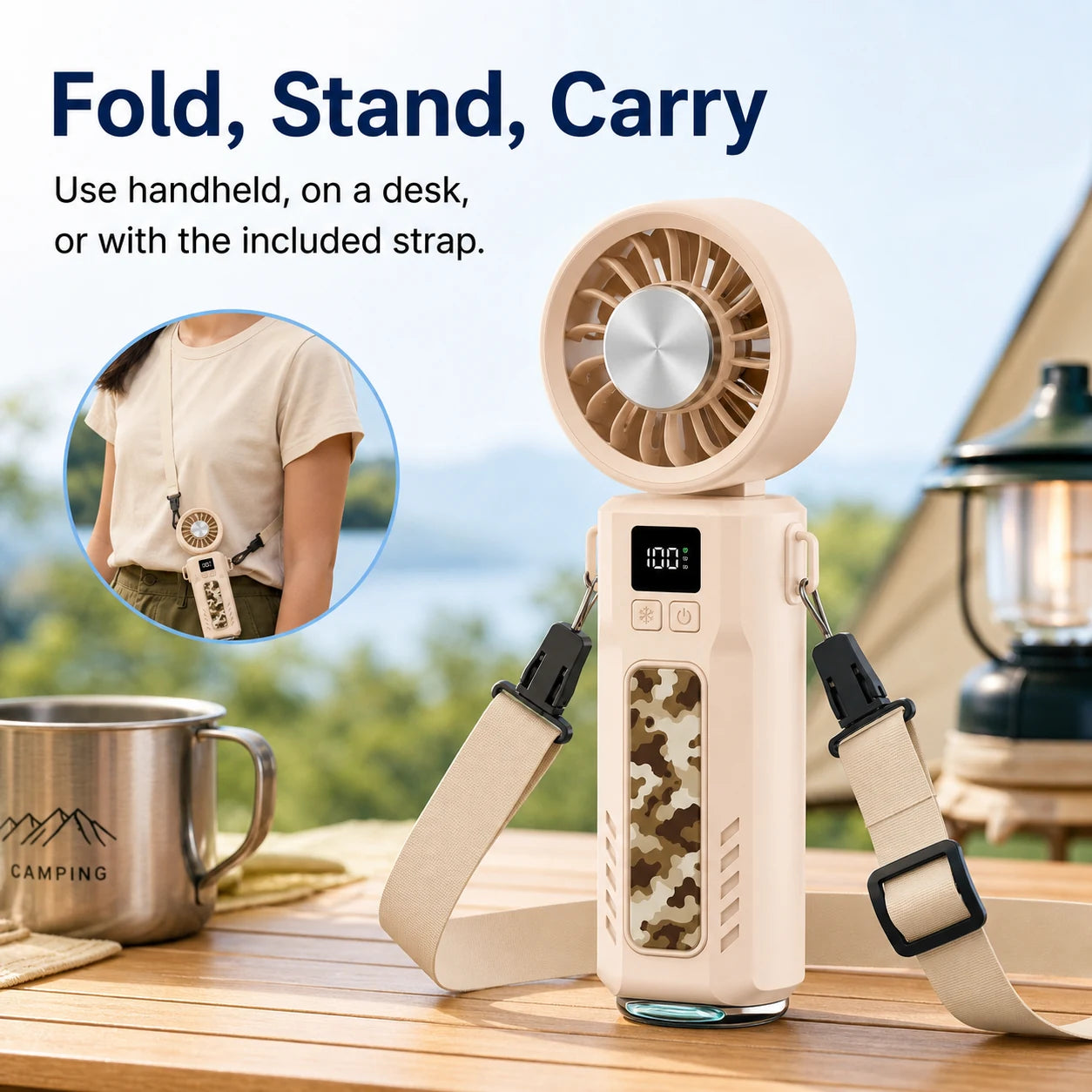 Foldable handheld fan used as a desktop stand and carried with the included strap