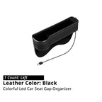 Left-side black car seat gap organizer with USB cable for filling the console gap and holding small items.