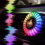 Music-sync car air freshener with RGB vent light adding colorful cabin atmosphere around the dashboard air outlet.