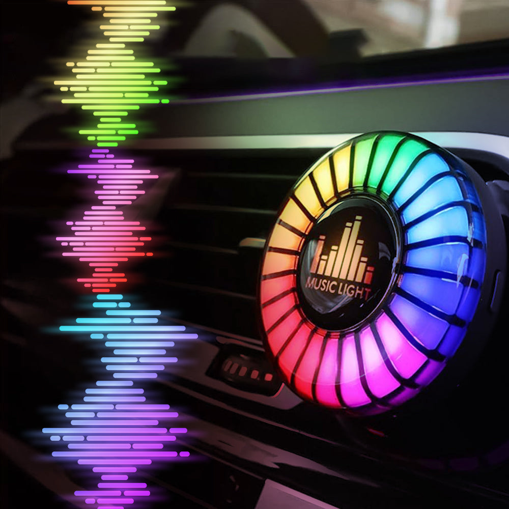 Music-sync car air freshener with RGB vent light adding colorful cabin atmosphere around the dashboard air outlet.