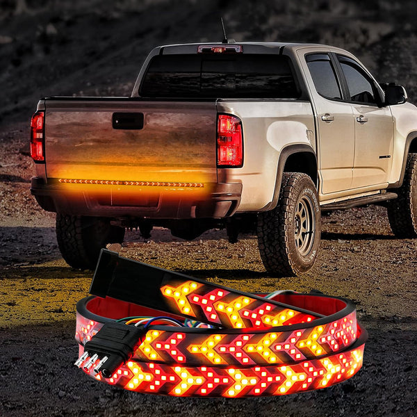 Pickup tailgate light bar installed across the rear of a truck for stronger brake and signal visibility after dark.