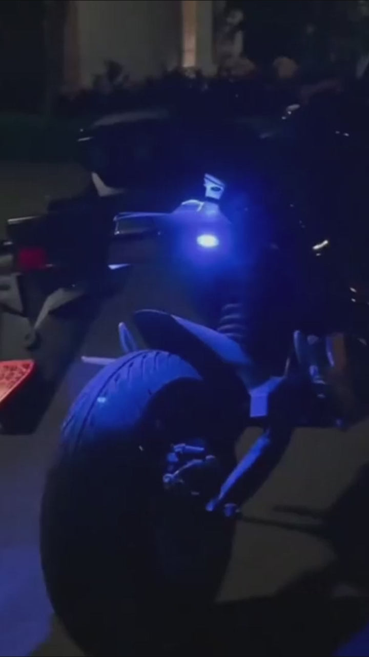 RGB bicycle frame lights create a blue night-riding glow for evening cycling visibility and custom bike styling.