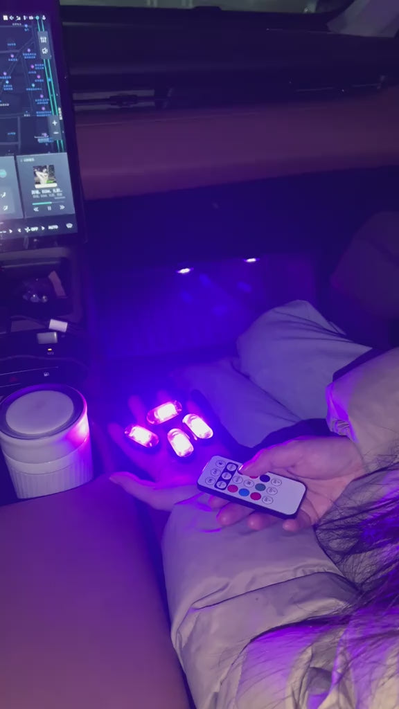 Magnetic RGB ambient lights adding colorful remote-controlled glow to a car interior and small accent spaces.