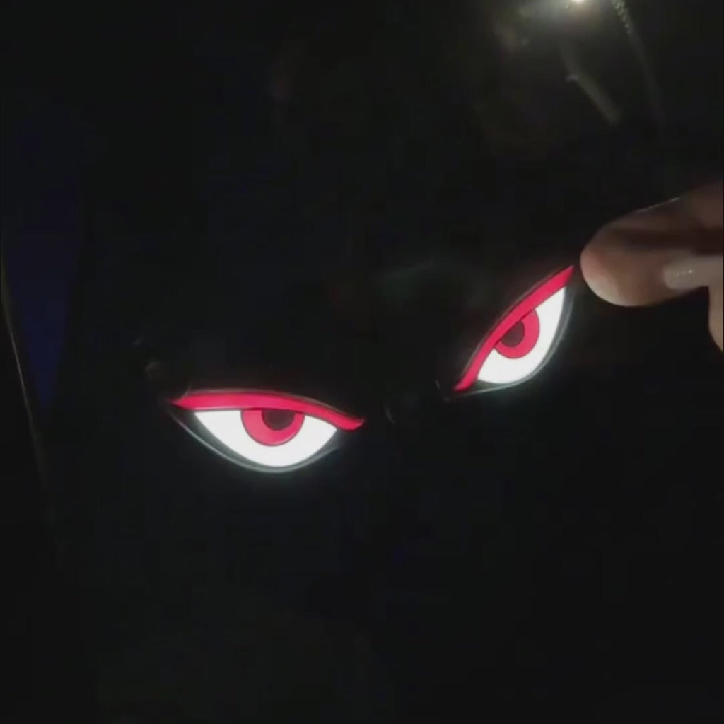Solar Devil Eyes window light creates a glowing red eye effect on vehicle glass for night display styling.