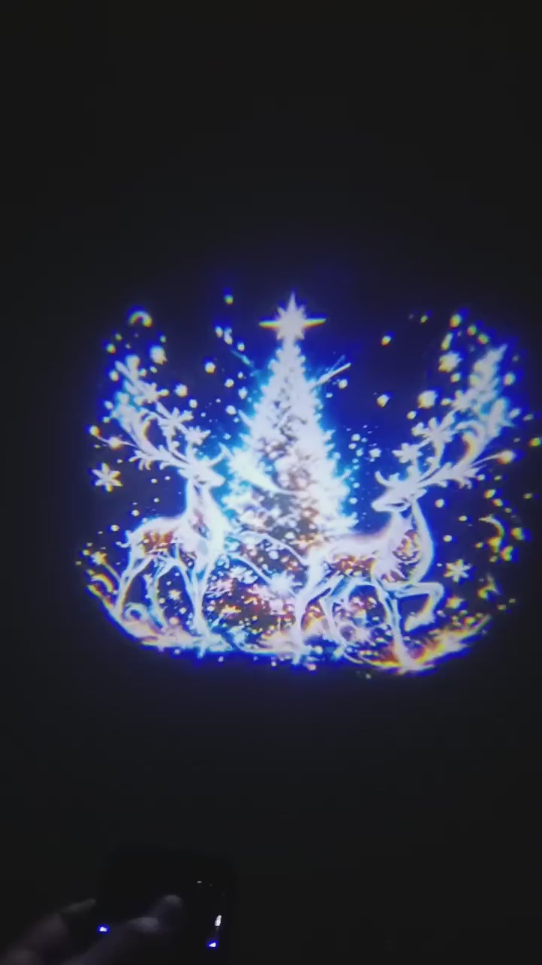 Animated Christmas car door projector light demonstration with festive 2-frame ground artwork beside an open vehicle door.