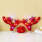 Red lighted Christmas car antlers set with matching Rudolph nose for festive vehicle holiday styling.