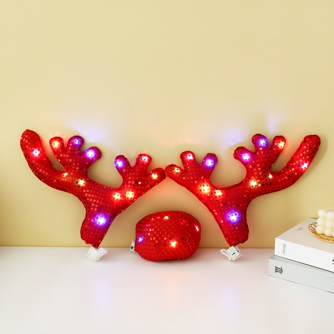 Red lighted Christmas car antlers set with matching Rudolph nose for festive vehicle holiday styling.