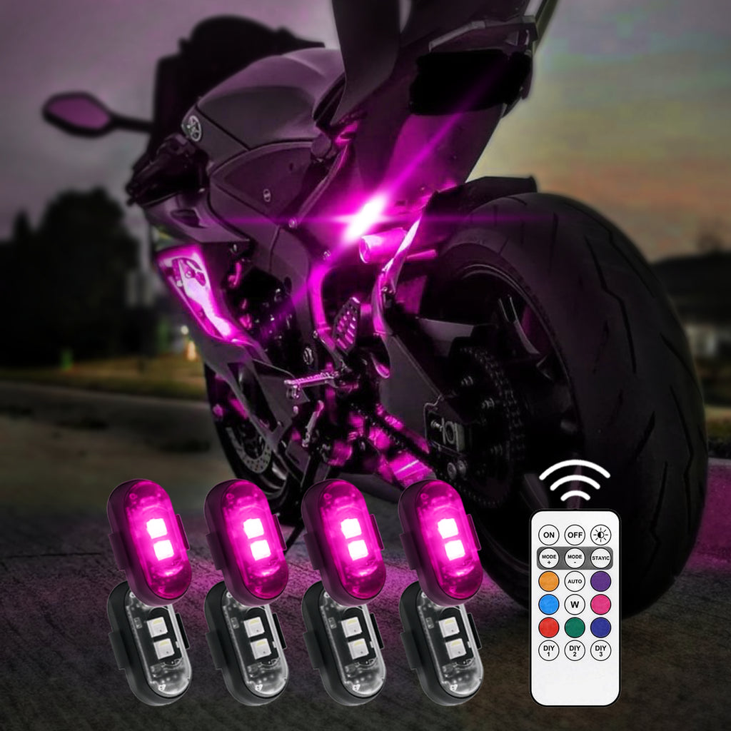 RGB motorcycle accent lights add a pink underglow around the bike for custom night-riding style.
