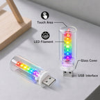 RGB USB light with touch area, LED filament, glass cover, and USB interface for compact mood lighting setups.