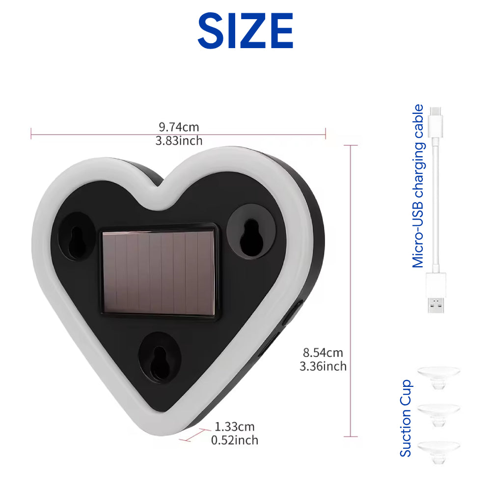 Solar heart LED light with compact body, solar panel, suction cups, and charging cable for window placement.