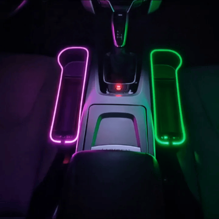 LED seat gap organizers glowing beside a car center console with storage close at hand